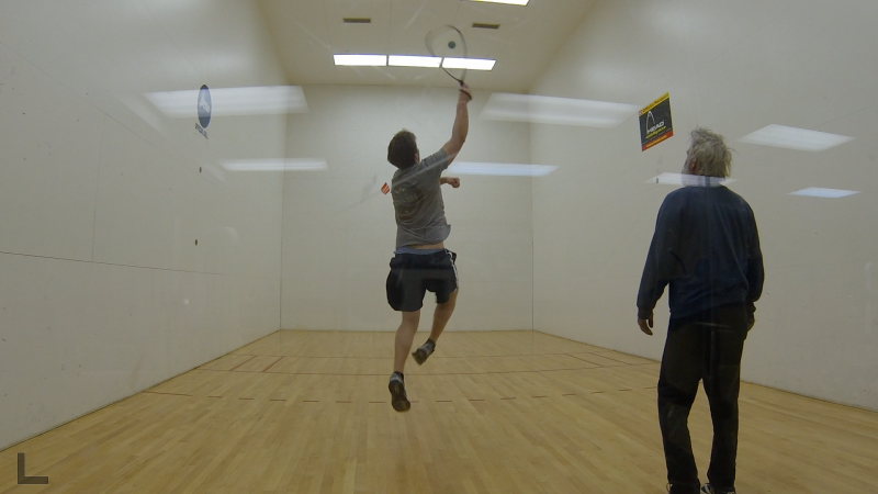 Ryan Leighton, a naïve staff reporter, plays Mike Lewis in a game of racquetball at the Boothbay Region YMCA.